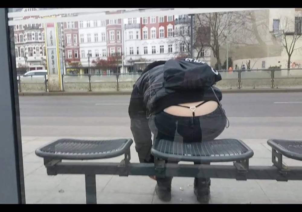 Girl showing her thong waiting at the bus stop - xhamster.com
