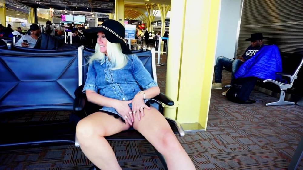 Blonde mature at the airport flashing and touching her pussy - xhamster.com - Usa