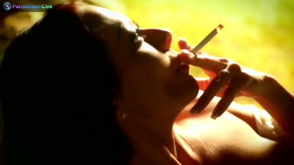 Sandra Romain smokes a cigarette and masturbates in the public park - fetishpapa.com