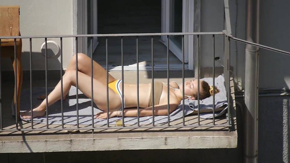 Student in bikini sunbathing on the balcony - xh.video - Italy