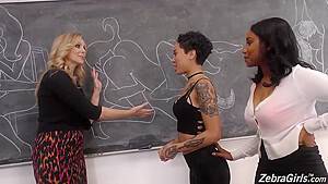 Lusty lesbians are having an interracial threesome in the classroom, while no one is watching them - hdzog.com