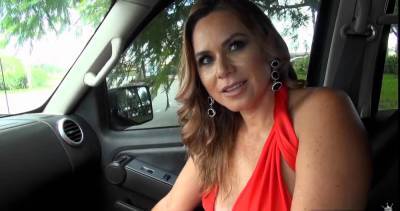 This steamy milf in stunning red dress is teasing and showing her shaved muff in the car - sunporno.com