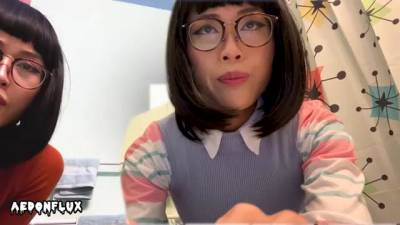 Nerdy Asian girls, Velma and Dr. Fujita are posing and teasing in front of the camera - sunporno.com