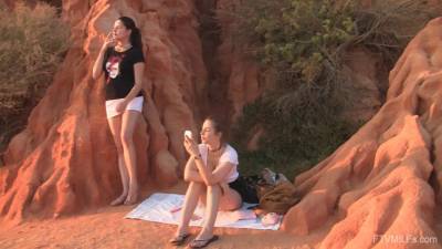 Sensual teens are having a wonderful time sharing the dildo at sunset - sunporno.com