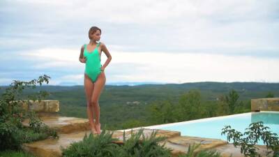 Lovely girl has a swimming pool with an amazing view, and likes posing nude next to it - sunporno.com