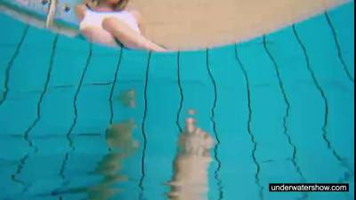 Teen girl Avenna is swimming in the pool - ah-me.com
