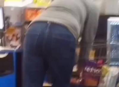 Sexy ass on brunnete milf in jeans at self checkout - voyeurhit.com