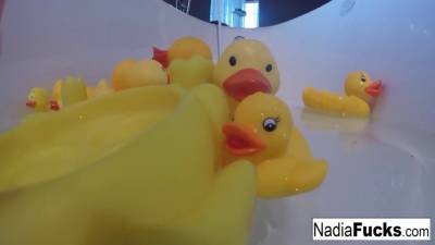 Nadia takes a bath with some rubber duckies - sexu.com