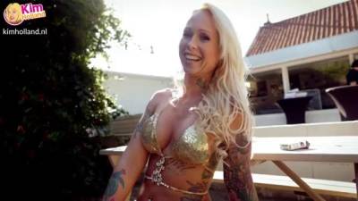 Busty, tattooed blonde in a golden bikini, Ashley More got down and dirty with a black hunk - sunporno.com