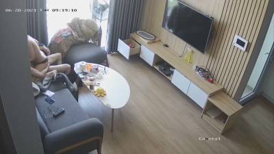 Young couple in livingroom, riding on sofa - voyeurhit.com