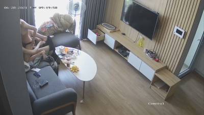 Young couple in livingroom, riding on sofa - voyeurhit.com