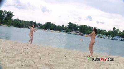 Nude beach girl is having a great time as she spreads her legs wide - hclips.com