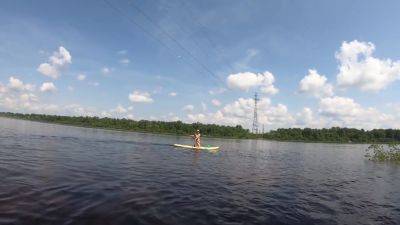 Girl Resting On A Wild Beach And Riding A Sup Board - hclips.com - Russia