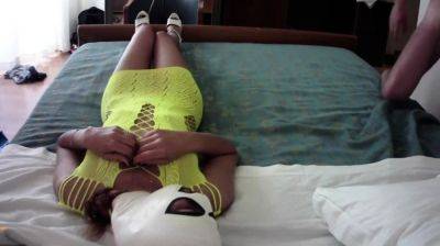 On yellow fishnet and high heels in a bed she has a big cock - drtuber.com