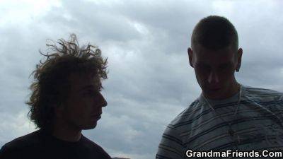 Two horny boys pound curvy blonde grandma outside in a wild threesome - sexu.com - Czech Republic