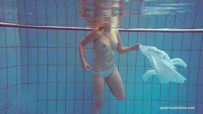 In The Indoor Pool, A Stunning Girl Swims - upornia.com