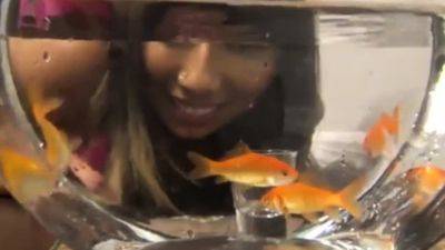 Hungry woman devours goldfish at dawn - Vore Fish - drtuber.com