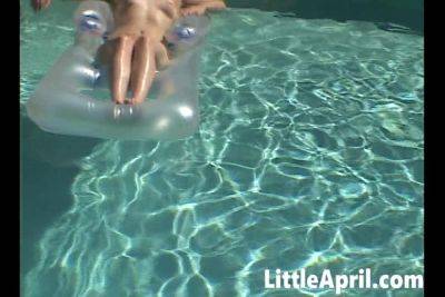 Little April fingers herself in the pool in a POV solo - txxx.com