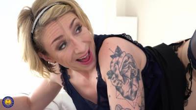 Tattooed blonde mature, Julie Holly likes the way a handsome guy is fucking her brains out - txxx.com