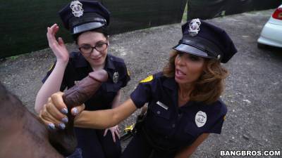 Sexy female cops share black meat on the street - xbabe.com
