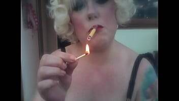 A Blonde Retro Mistress Smoking A Yellow Sobranie Cigarette With Match Light Up - xvideos.com - Britain