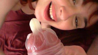 Redhead is drinking tasty sperm from that condom - hellporno.com