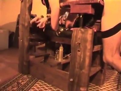 Strict latex-clad mistress disciplines her submissive with the whip in a rustic dungeon - yesvids.com